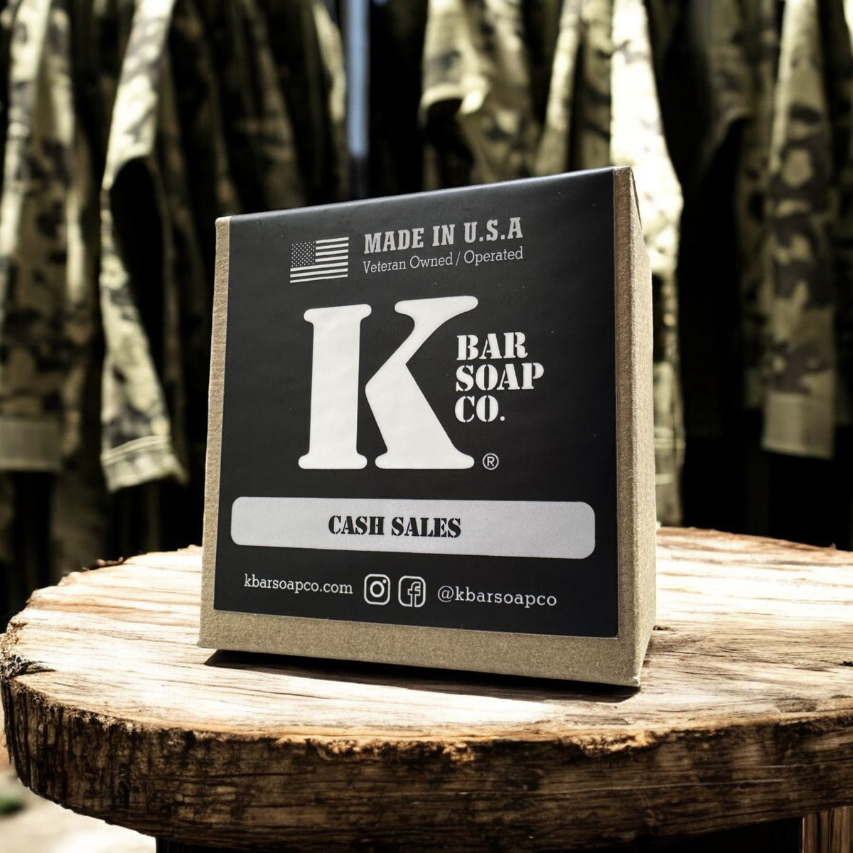 Cash Sales bar soap box on a wood stand in front of camouflage uniforms