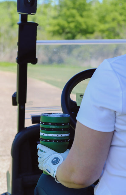 Person holding a tally tumbler and driving golf cart 