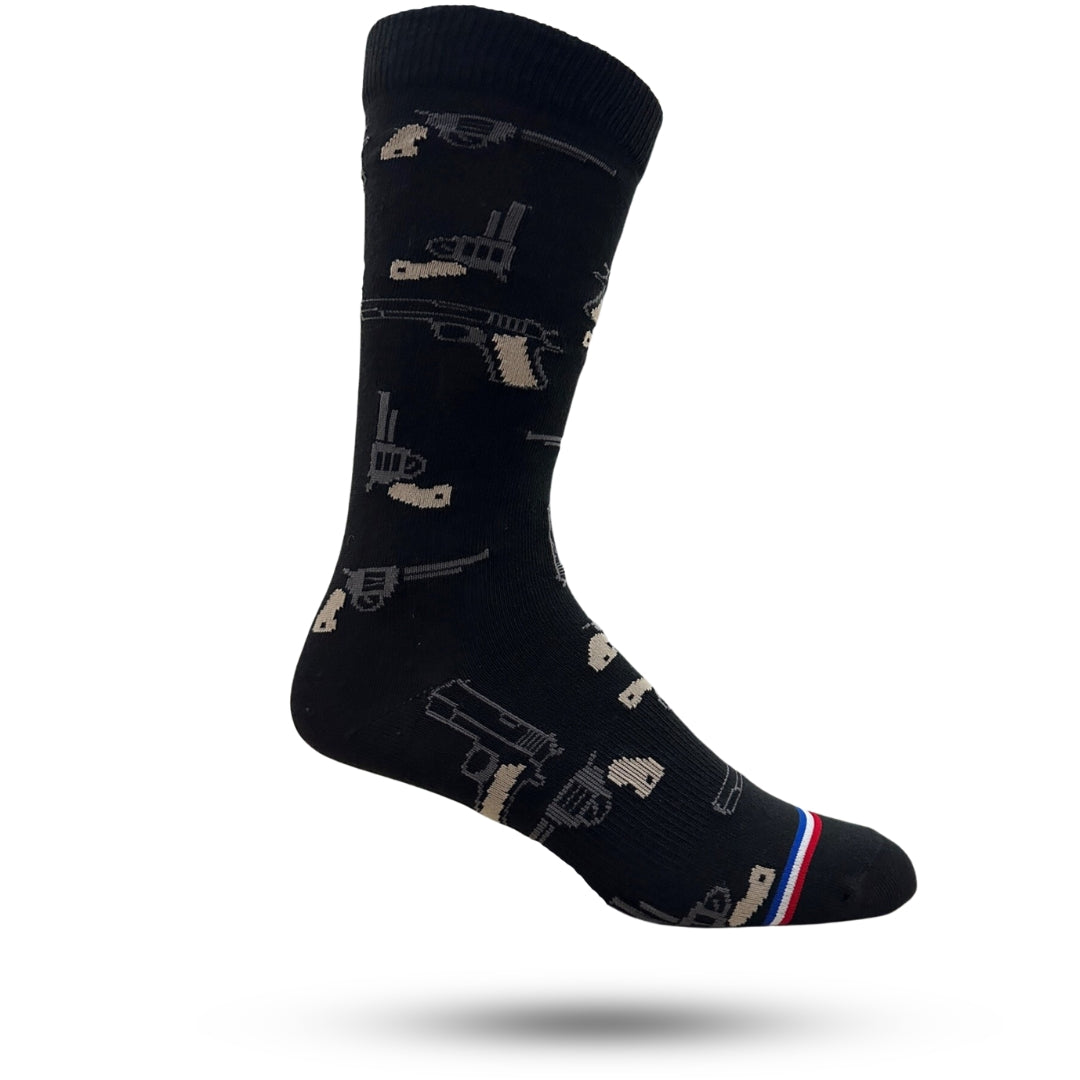 A pair of black casual crew socks with a vintage gun pattern 