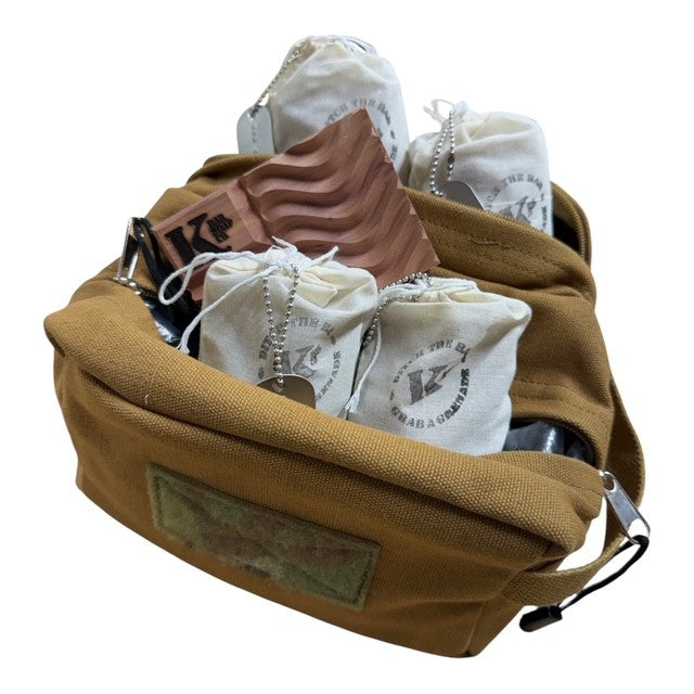 
                  
                    A tan canvas pouch filled with white drawstring pouches and a brown textured item, photographed on a plain white background.
                  
                