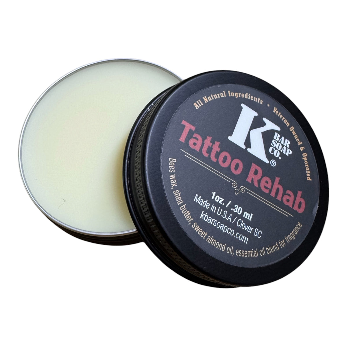 Tattoo Rehab balm in a black container with visible branding on a white background