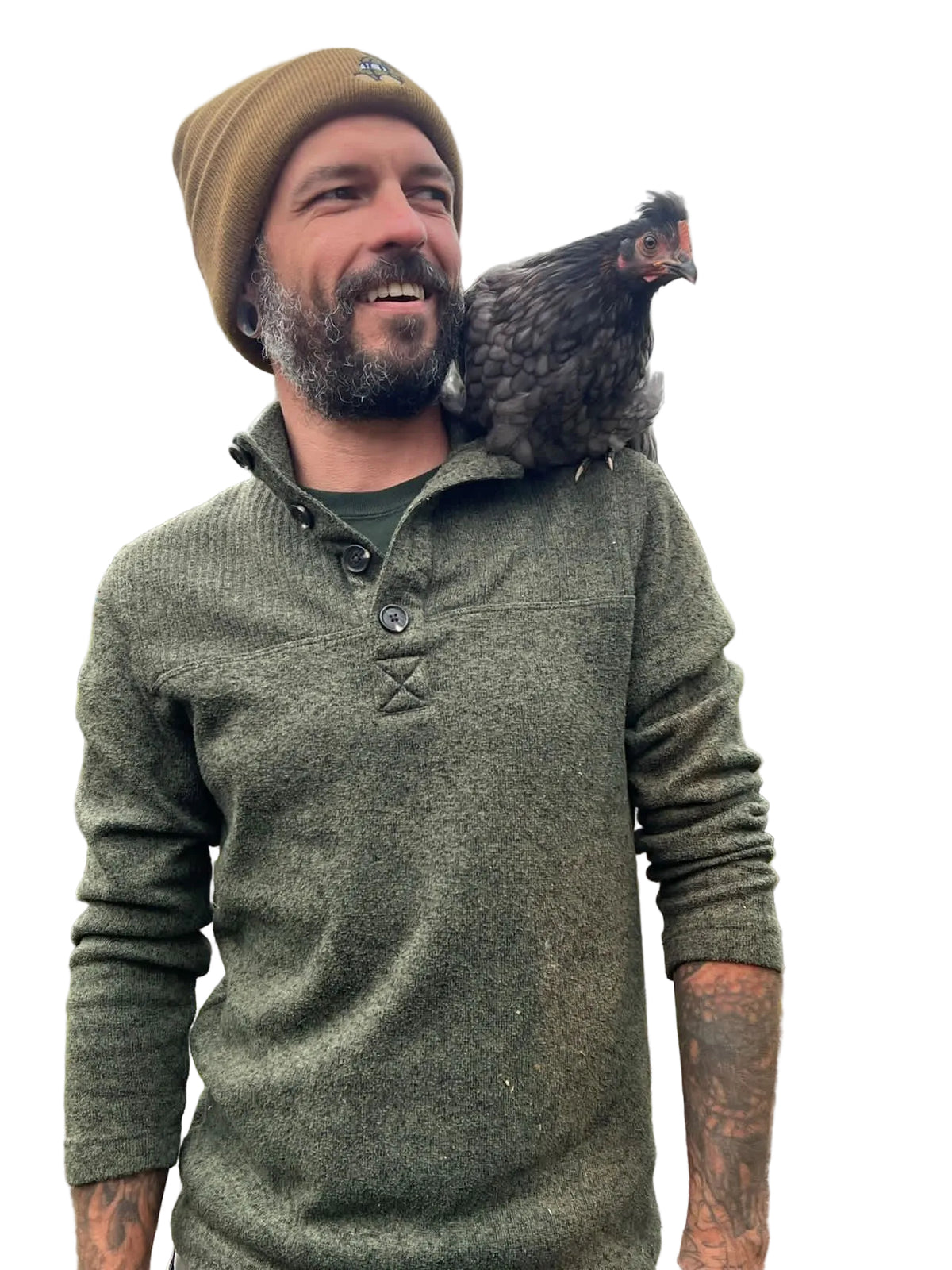 Man wearing a green sweater and brown beanie with a chicken on his shoulder against a white background