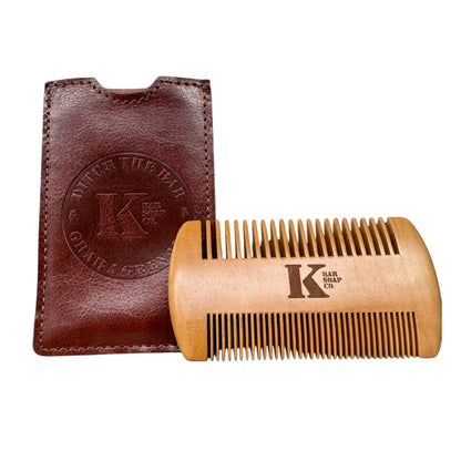 Wooden comb with Kbar Soap logo and brown leather case 