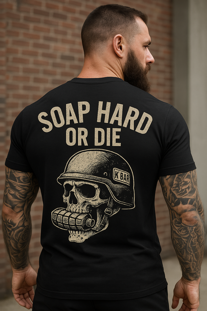 Man wearing Black T-shirt showing backside of shirt that says ' Soap Hard or Die' with a skull with grenade in mouth 