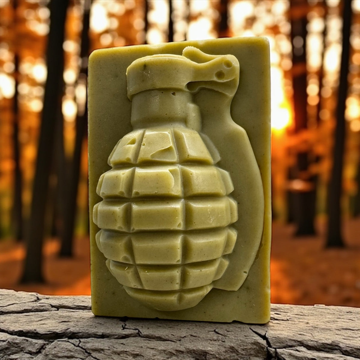 First Light grenade soap bar on a log in an autumn forest