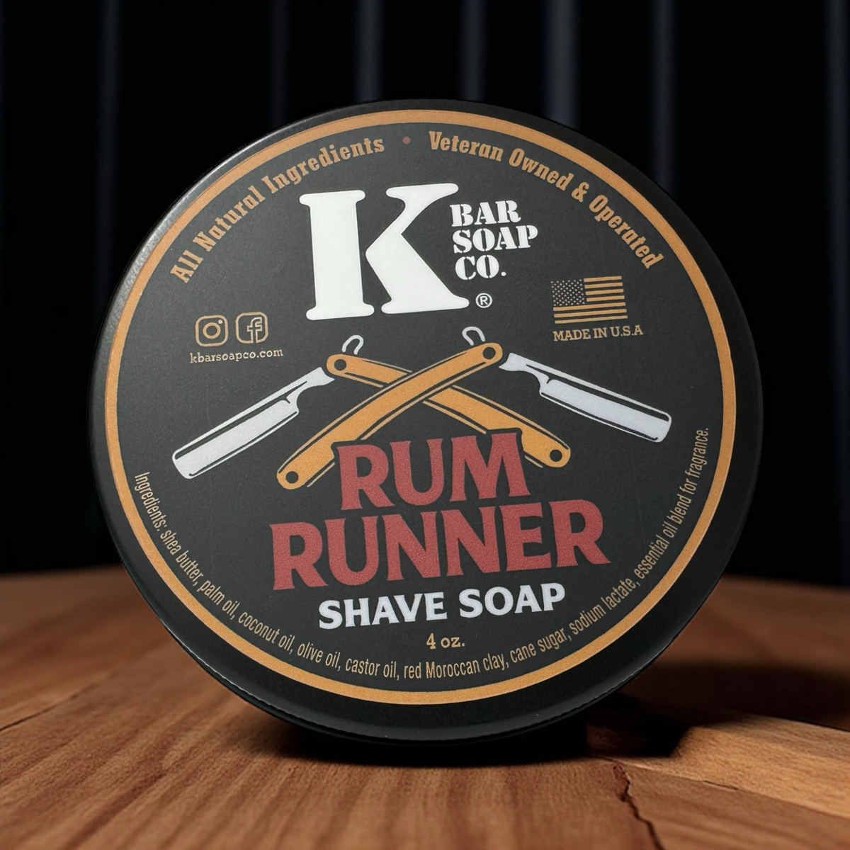K Bar Soap Co. Rum Runner Shave Soap container on a wooden surface with a dark background
