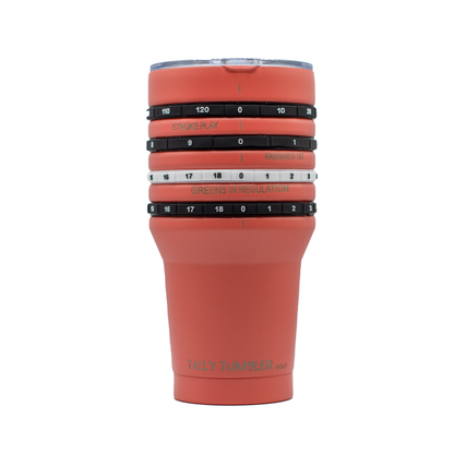 Coral colored tumbler with golf-themed measurements on a white background