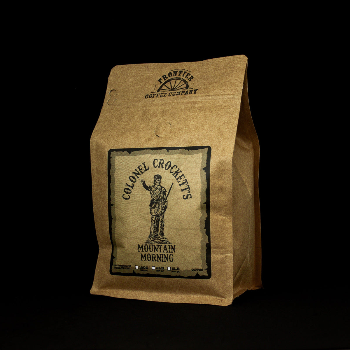 A paper bag packaging for Col. Crockett's Medium Roast coffee with a printed label featuring an illustration of a male figure and the name of the coffee variety.