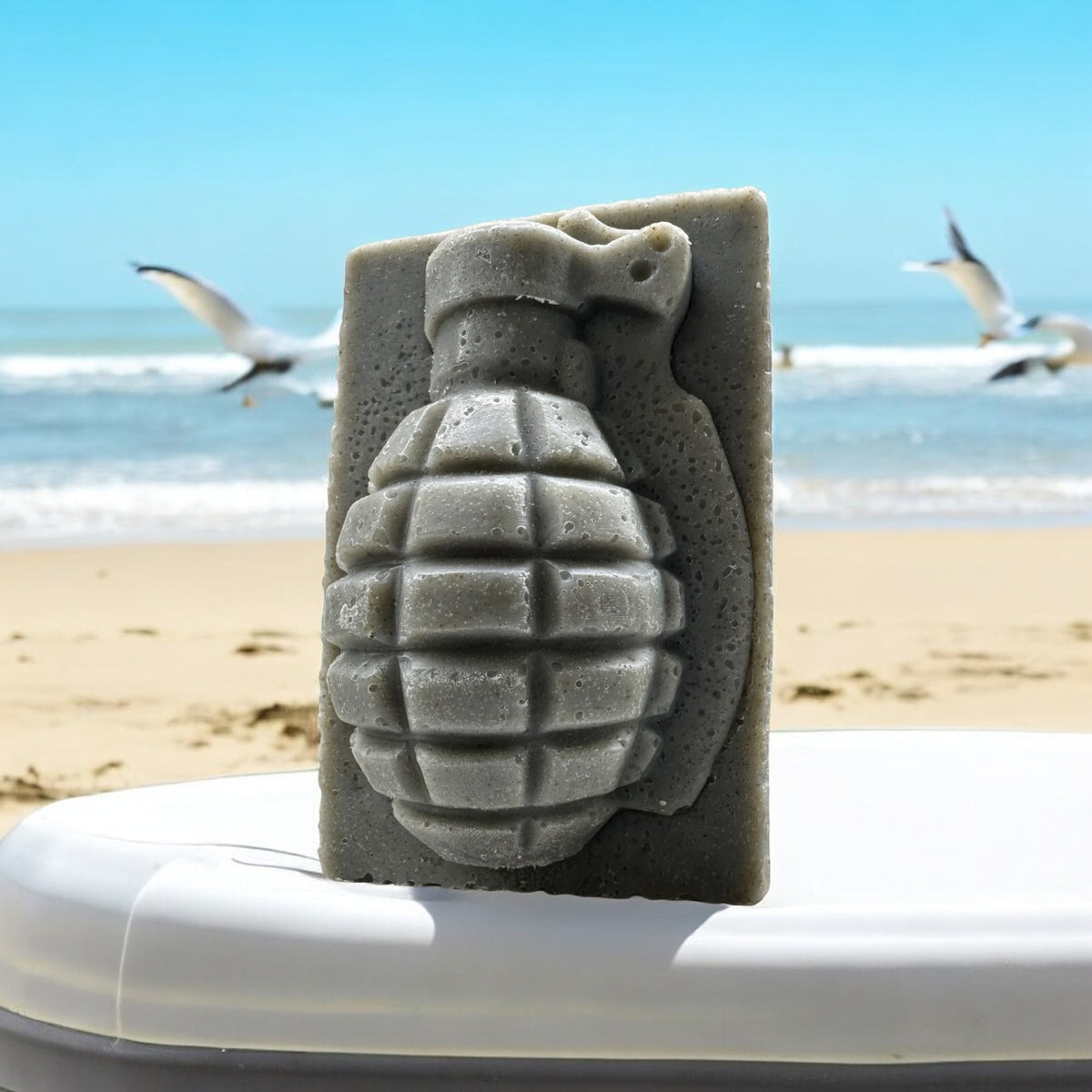 Kaneohe Bay juniper grenade soap bar on a beach with seagulls