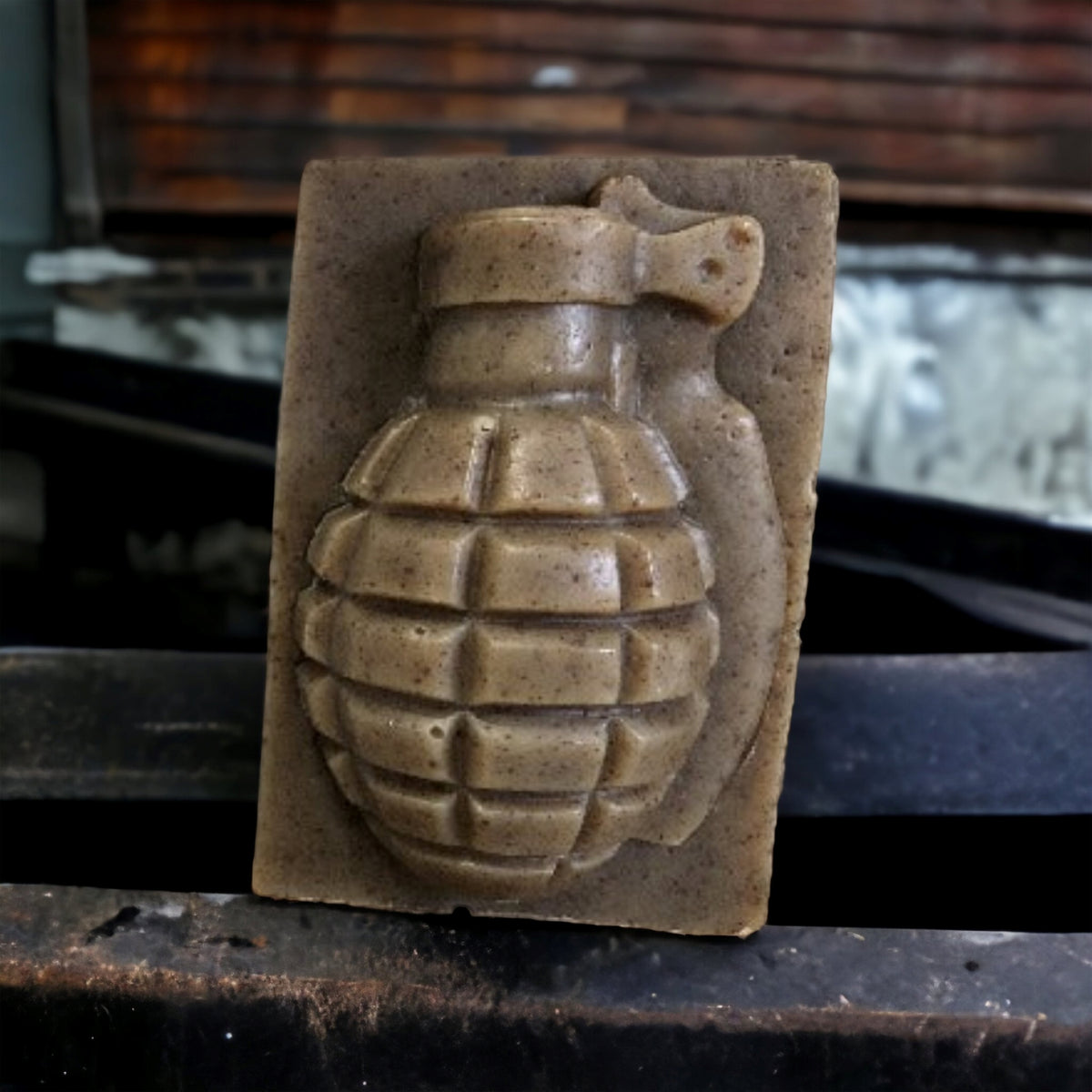 Lather-neck sandalwood grenade soap bar on a rustic wood shelf