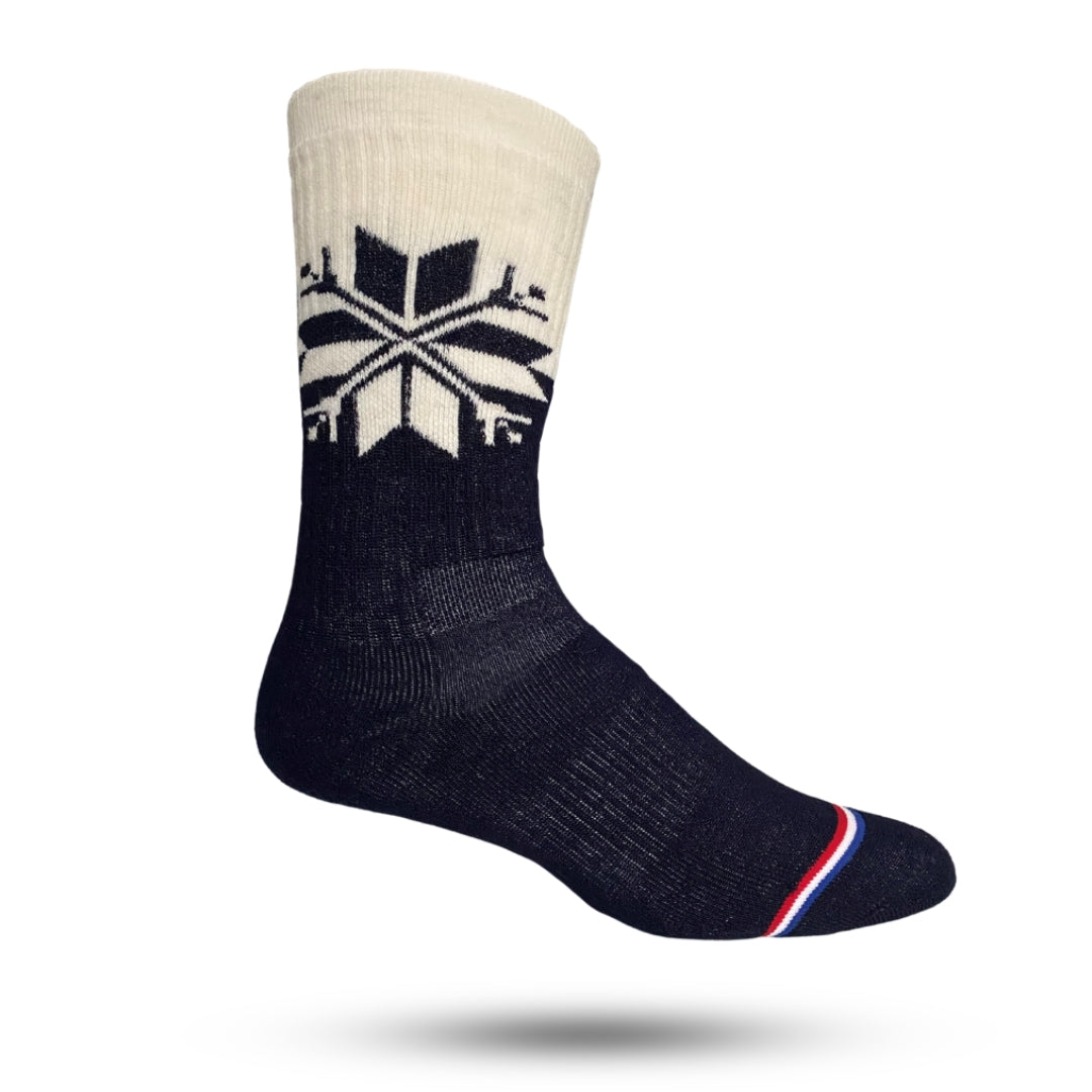 Crew socks in navy and cream color with large snowflake 