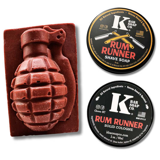 Grenade-shaped bar of soap with two containers of Rum Runner cologne and soap on a white background