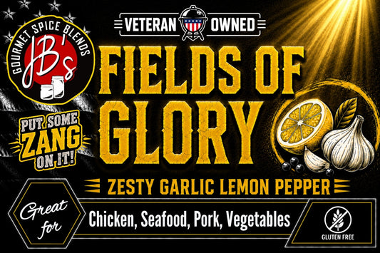 A promotional graphic for JB's Gourmet Spice Blends, featuring the product name 'Fields of Glory' in large yellow text. The design includes a 'Veteran Owned' badge, a 'Put Some Zang On It!' slogan, illustrations of garlic, a lemon slice, and peppercorns, and a list of suitable ingredients: Chicken, Seafood, Pork, Vegetables.