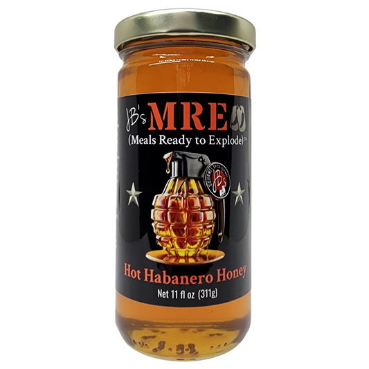 A glass jar of 'B's MRE Hot Habanero Honey' with a black label and gold lid, featuring a graphic of a honeycomb grenade on a white background.