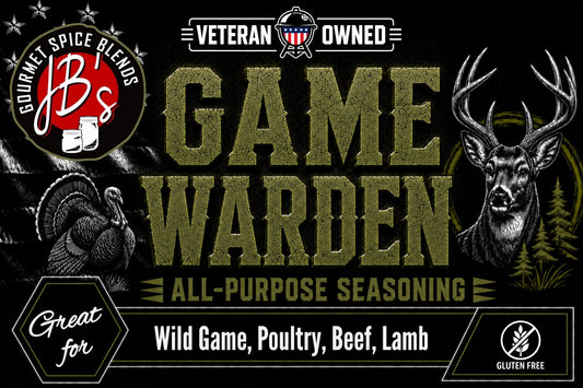 Promotional graphic for JB's Veteran Owned Game Warden All-Purpose Seasoning, featuring a black background with distressed olive-green lettering, a deer head illustration, a turkey silhouette, and flavor text for wild game, poultry, beef, and lamb.