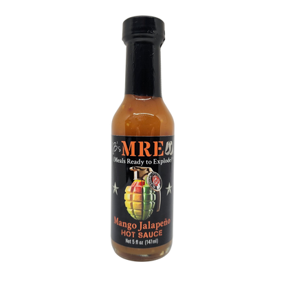 A bottle of MRE's Mango Jalapeño Hot Sauce on a plain white background. The bottle contains an orange-brown sauce and features a black label with a colorful grenade graphic and the brand name MRE's.