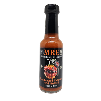 A bottle of JB's MRE Fire Roasted Habanero Hot Sauce on a clean white background. The bottle contains a vibrant orange-red sauce and features a black label with a graphic of a grenade made from habanero peppers and a hand grenade mechanism.