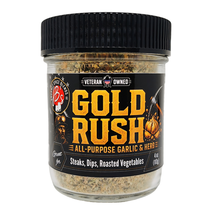 A jar of Gold Rush seasoning blend by Veteran Owned, featuring a black lid and a black label with bold yellow text, shown on a plain white background.