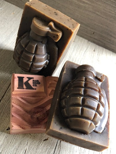 
                  
                    2 Grenade Soaps laying on K Bar Cedar Soap Dish
                  
                