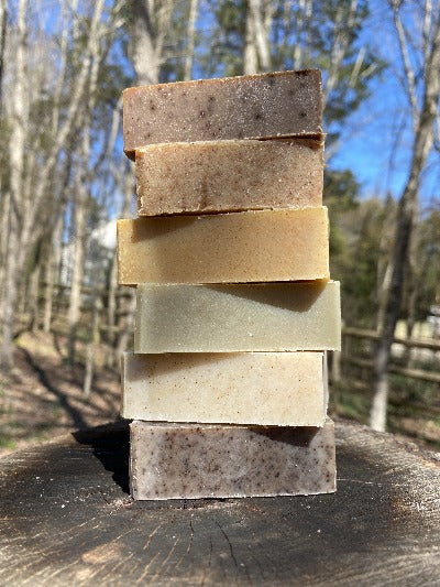 6 bars of natural soap stacked outside