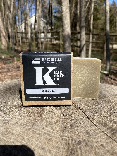 
                  
                    K Bar Cash Sales Soap Bar in black packaging with logo
                  
                