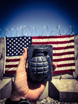 Hand holding grenade soap in front of American flag