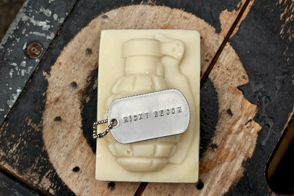 Ricky Recon Grenade Soap with dog tag on top of wood